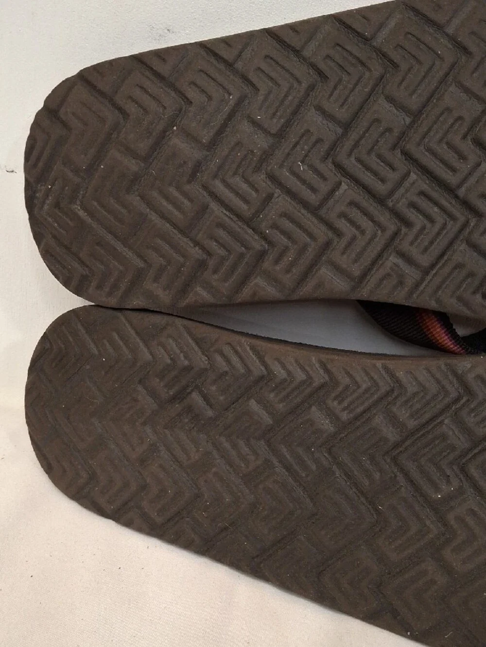 Teva Men's Brown Thong Flip Flops with Mauve and Orange Accents.Lightly Worn